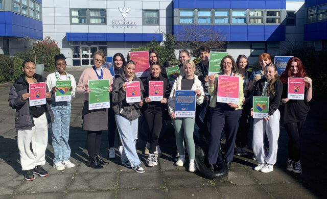 Pictured: Staff and students with placards and posters they’ll be carrying when 600 students take part in a Colour Walk to mark Neurodiversity Celebration Week on March 20